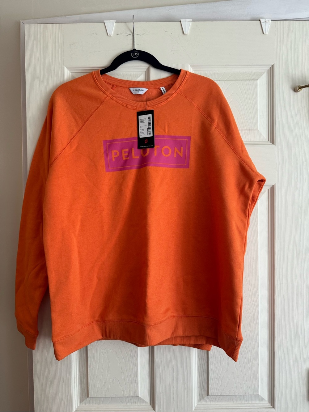 Peloton Orange Crewneck Sweatshirt with Pink Logo